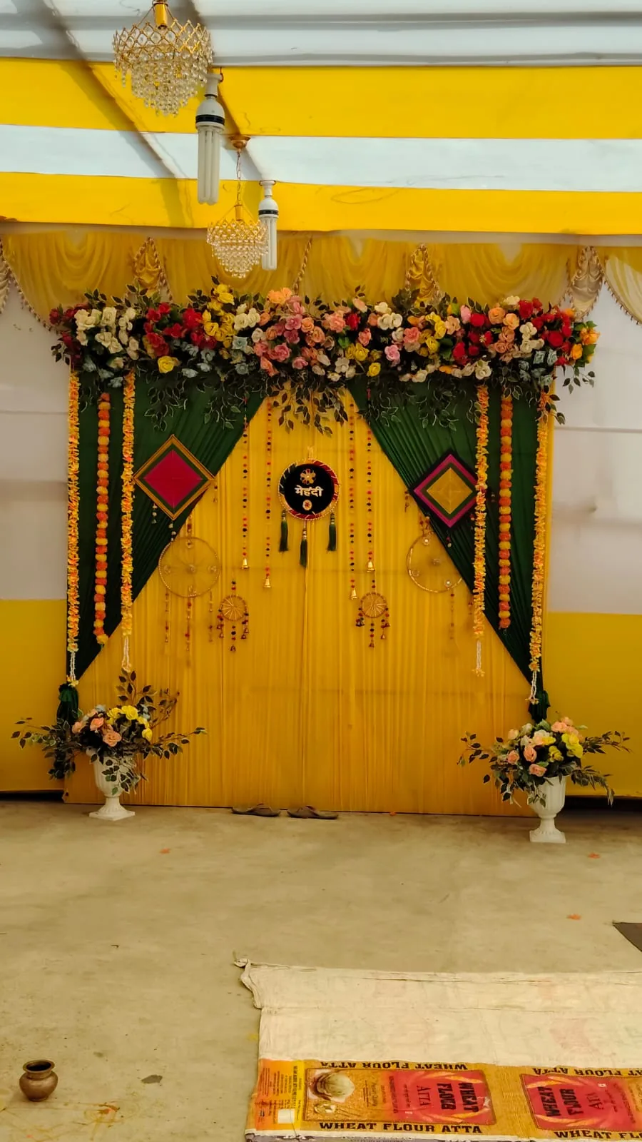 Yellow and green floral mehendi backdrop decoration